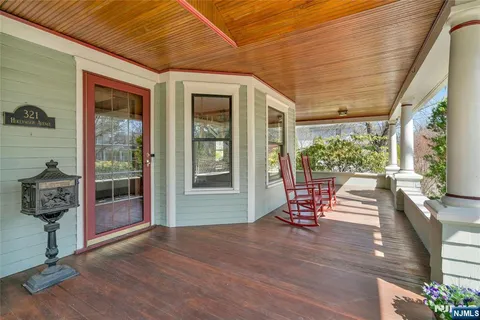 a view of two chairs in the balcony