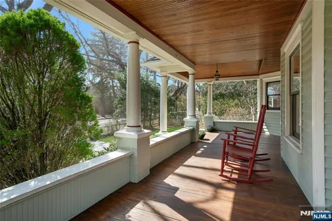 a sitting area with furniture and wooden deck