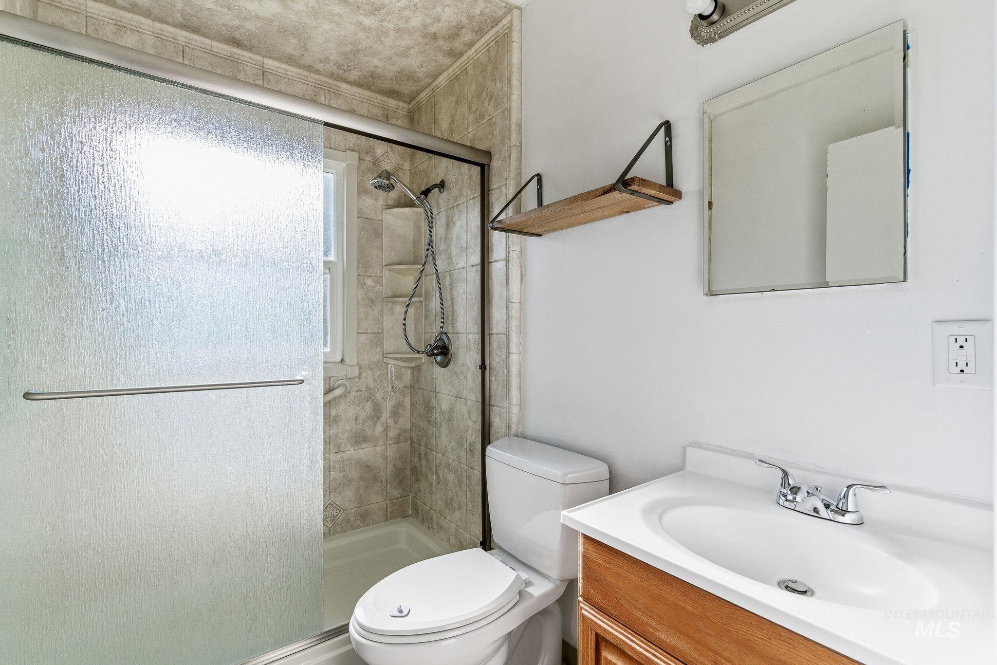 5603 West Edson Street Boise, ID 83705 - Photo 24 of 43 Full bathroom with vanity and a stall shower
