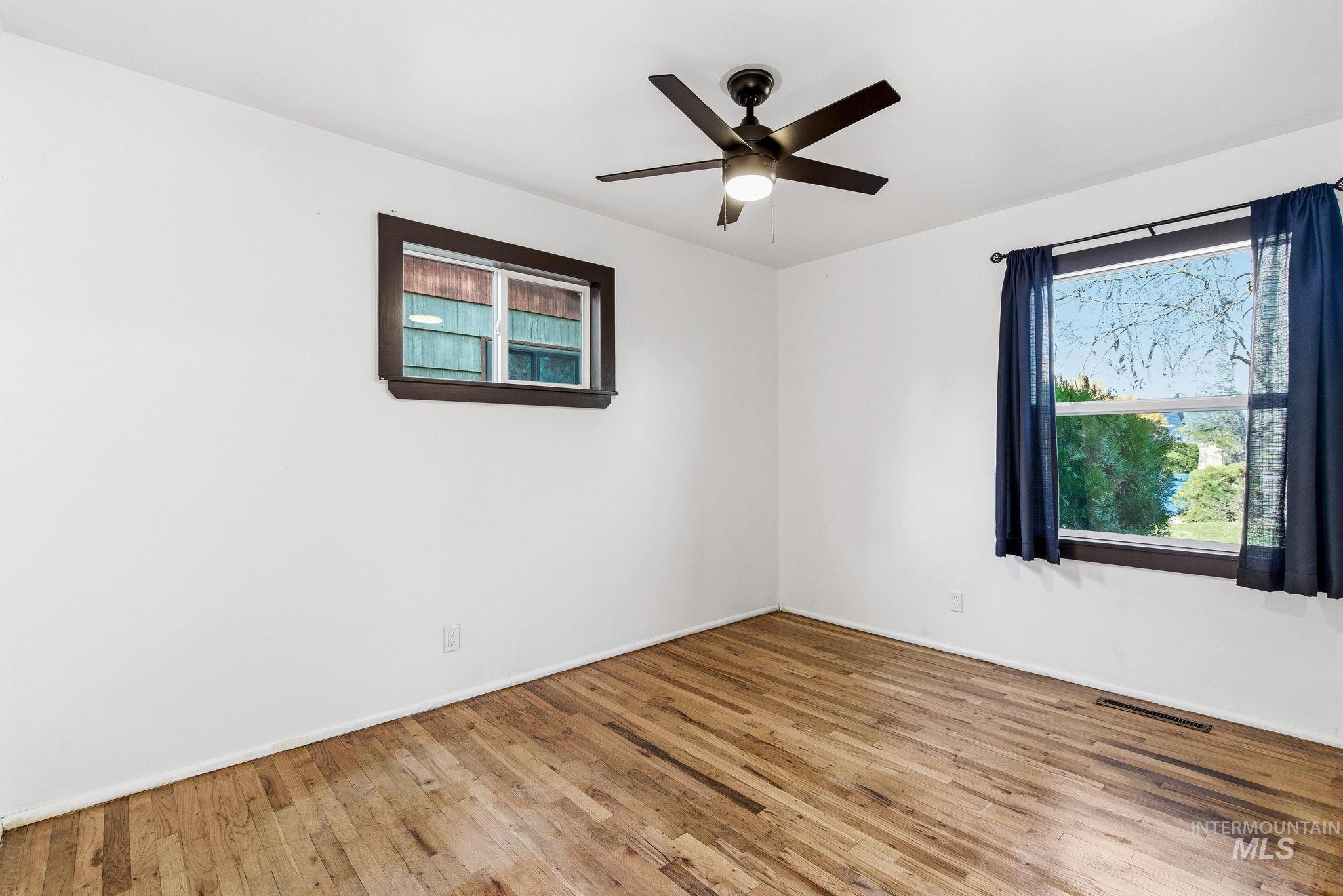 5603 West Edson Street Boise, ID 83705 - Photo 27 of 43 Unfurnished room featuring hardwood / wood-style flooring and ceiling fan