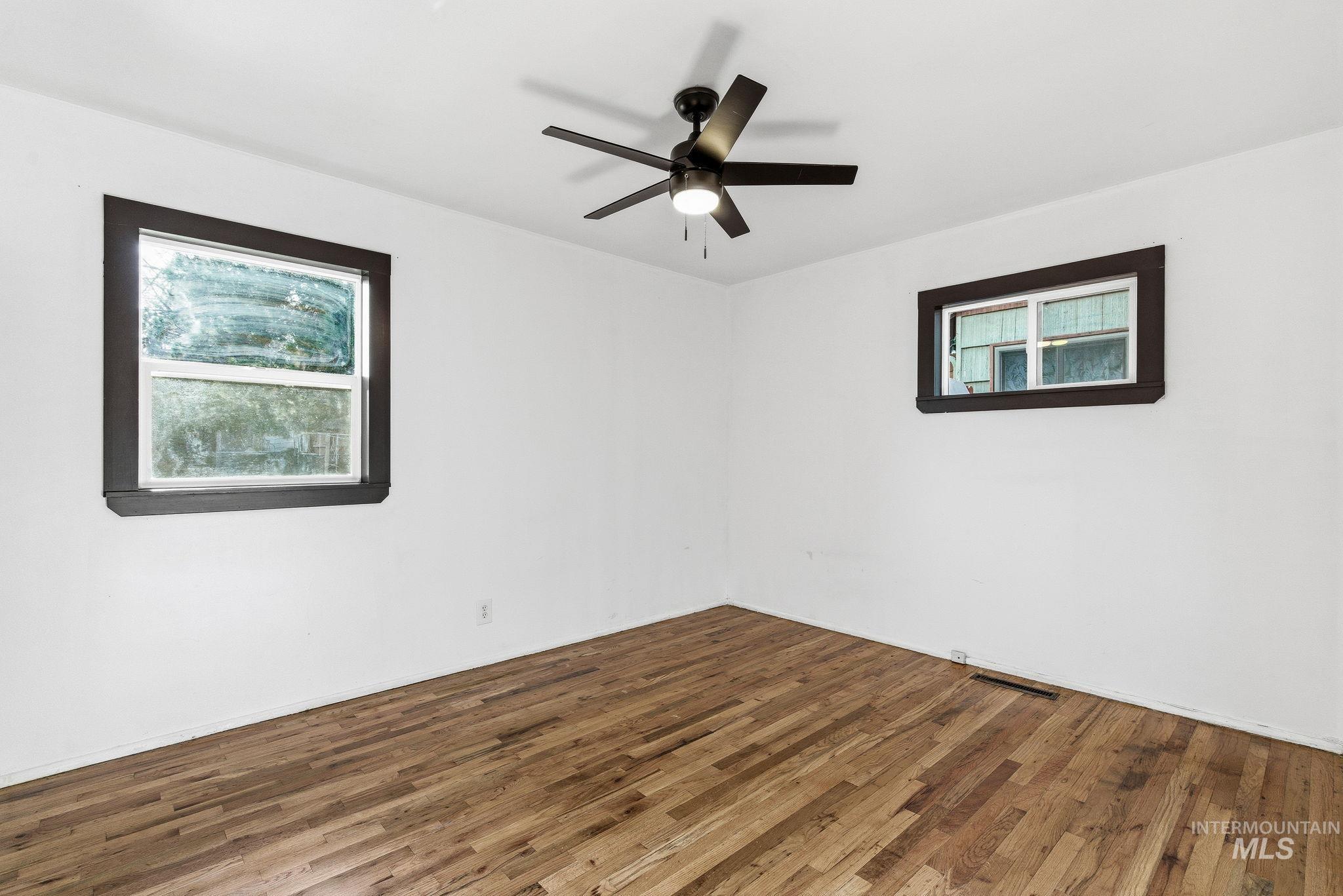 5603 West Edson Street Boise, ID 83705 - Photo 29 of 43 Spare room featuring hardwood / wood-style floors and a ceiling fan