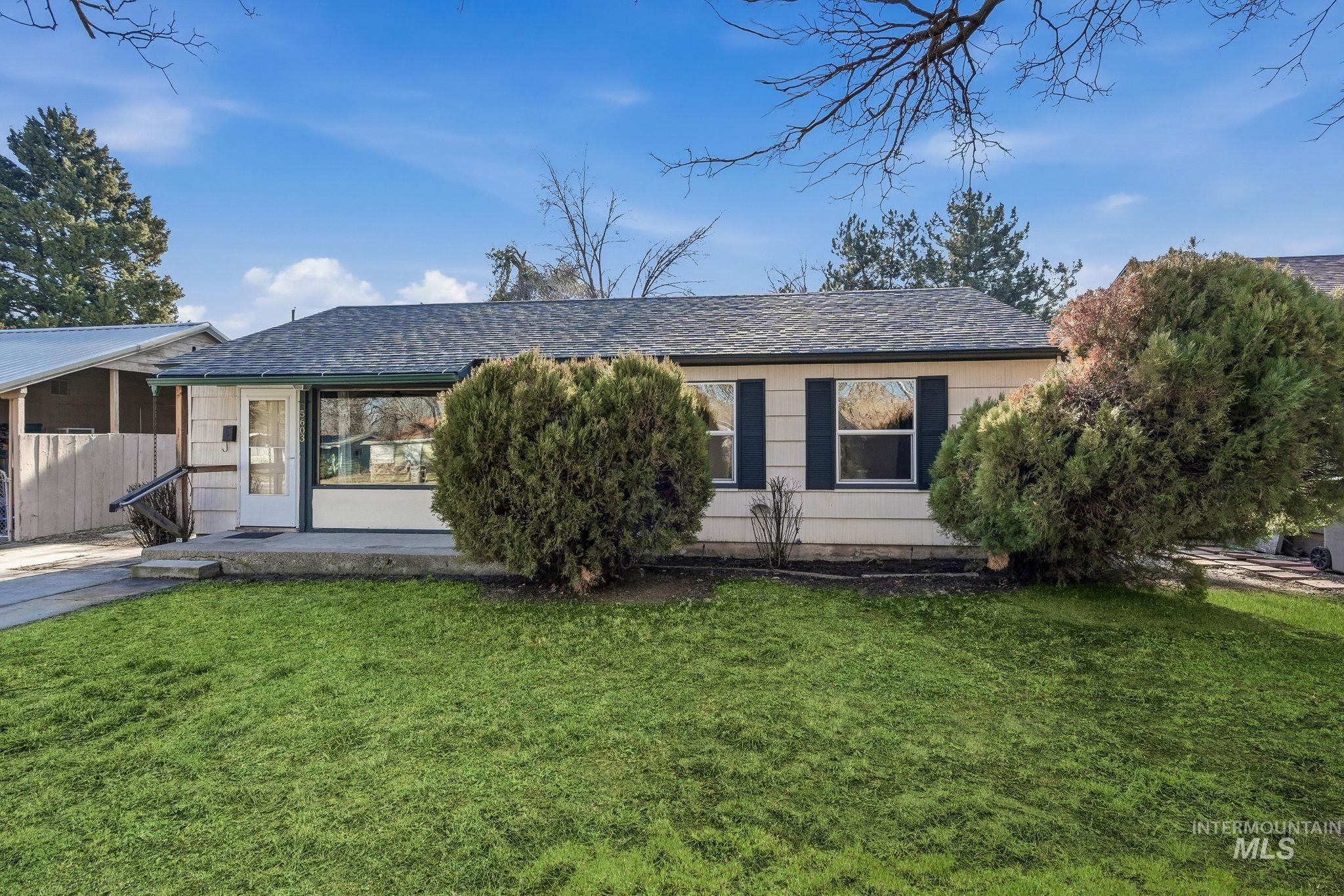 5603 West Edson Street Boise, ID 83705 - Photo 3 of 43 View of front of property with a front lawn and roof with shingles