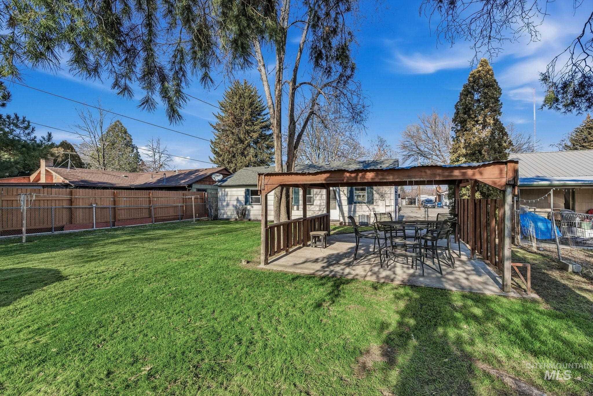 5603 West Edson Street Boise, ID 83705 - Photo 35 of 43 Fenced backyard with a patio