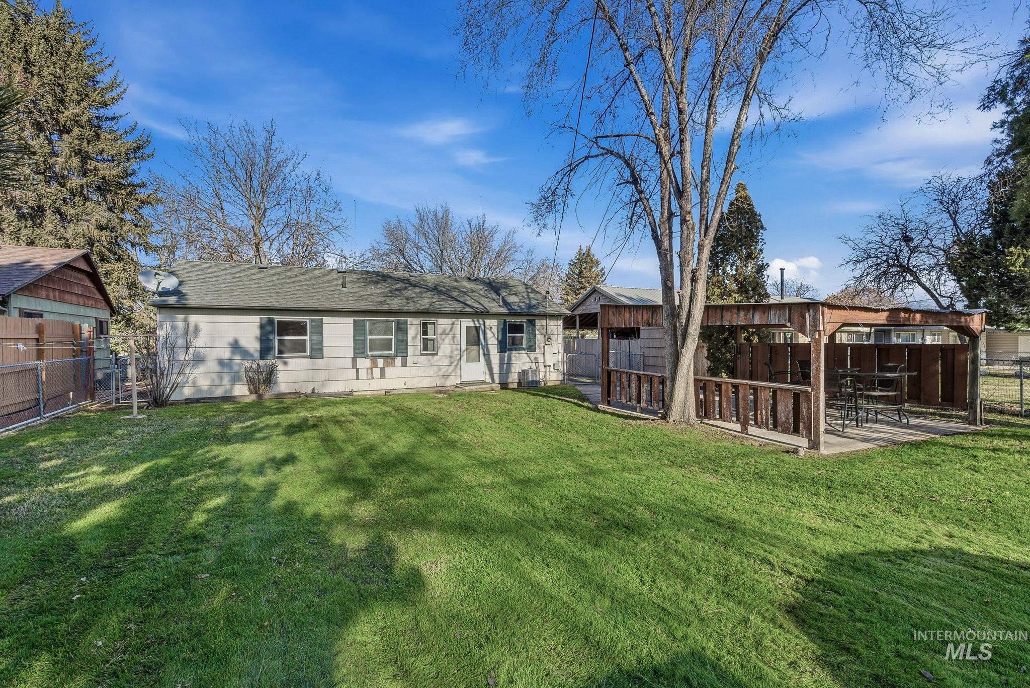 5603 West Edson Street Boise, ID 83705 - Photo 36 of 43 Back of property featuring a fenced backyard