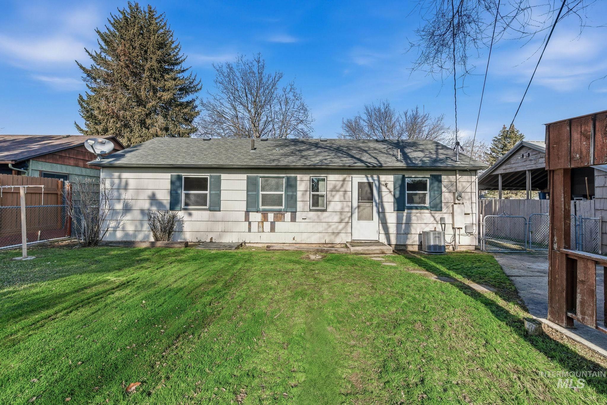 5603 West Edson Street Boise, ID 83705 - Photo 37 of 43 Back of house featuring roof with shingles