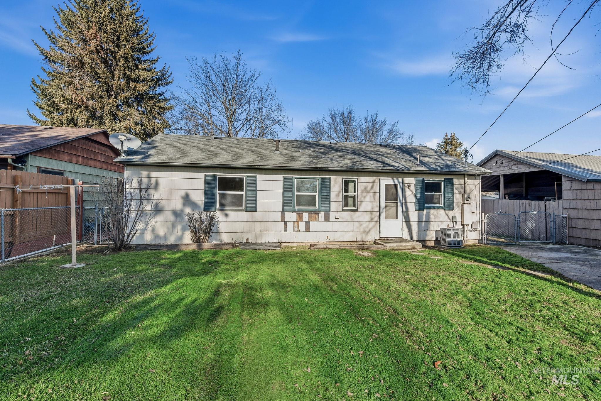 5603 West Edson Street Boise, ID 83705 - Photo 39 of 43 Back of property featuring roof with shingles