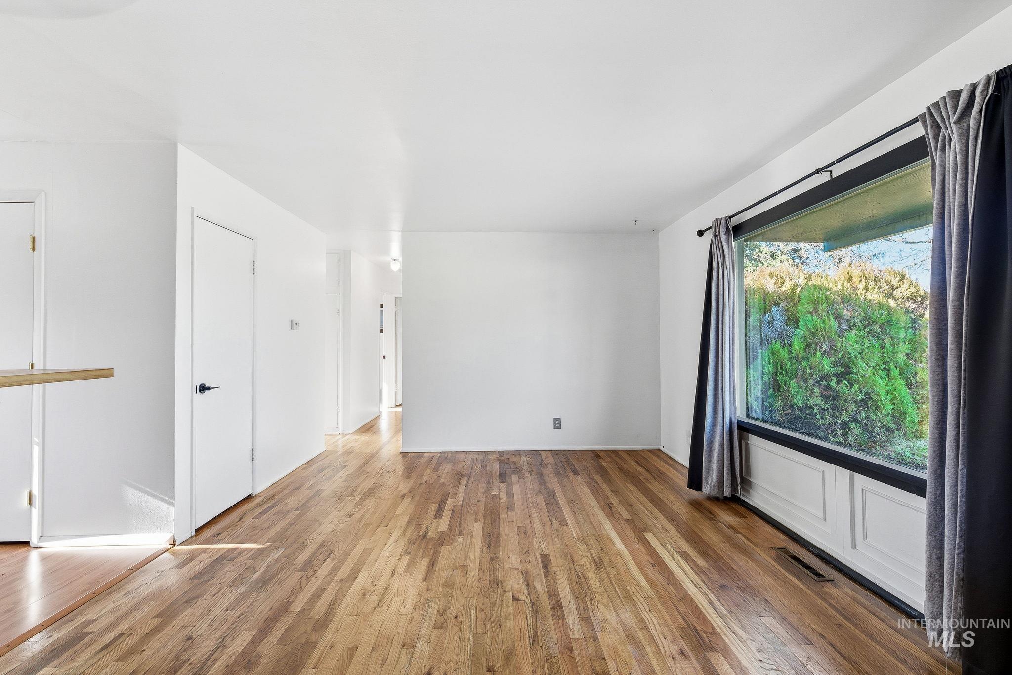 5603 West Edson Street Boise, ID 83705 - Photo 10 of 43 Spare room featuring hardwood / wood-style flooring