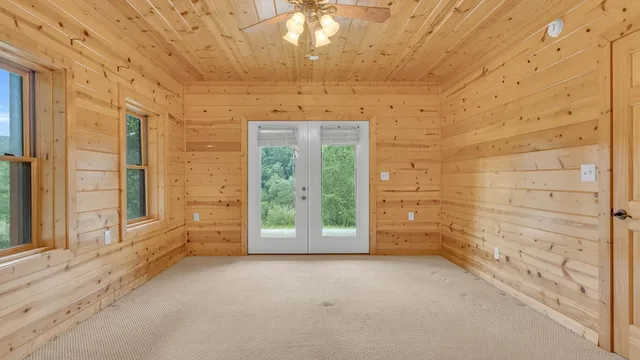 a view of a dry yard with mountains in the background