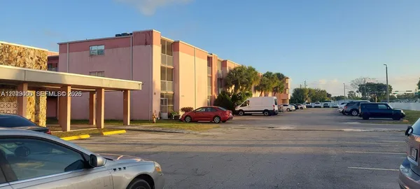 a view of street with parked cars