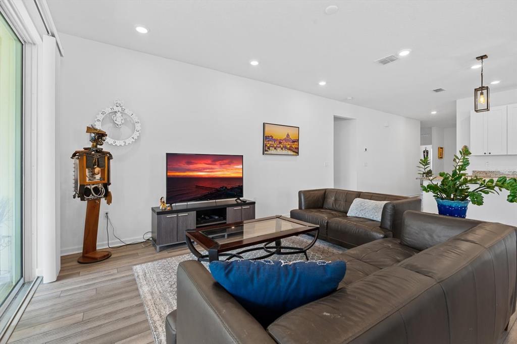 33 Ridge Road Palm Coast, FL 32137 - Photo 11 of 31 a living room with furniture and a flat screen tv