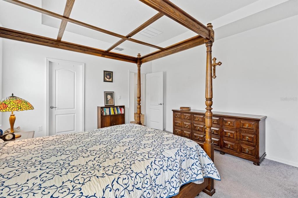 33 Ridge Road Palm Coast, FL 32137 - Photo 15 of 31 a bedroom with a bed and a dresser