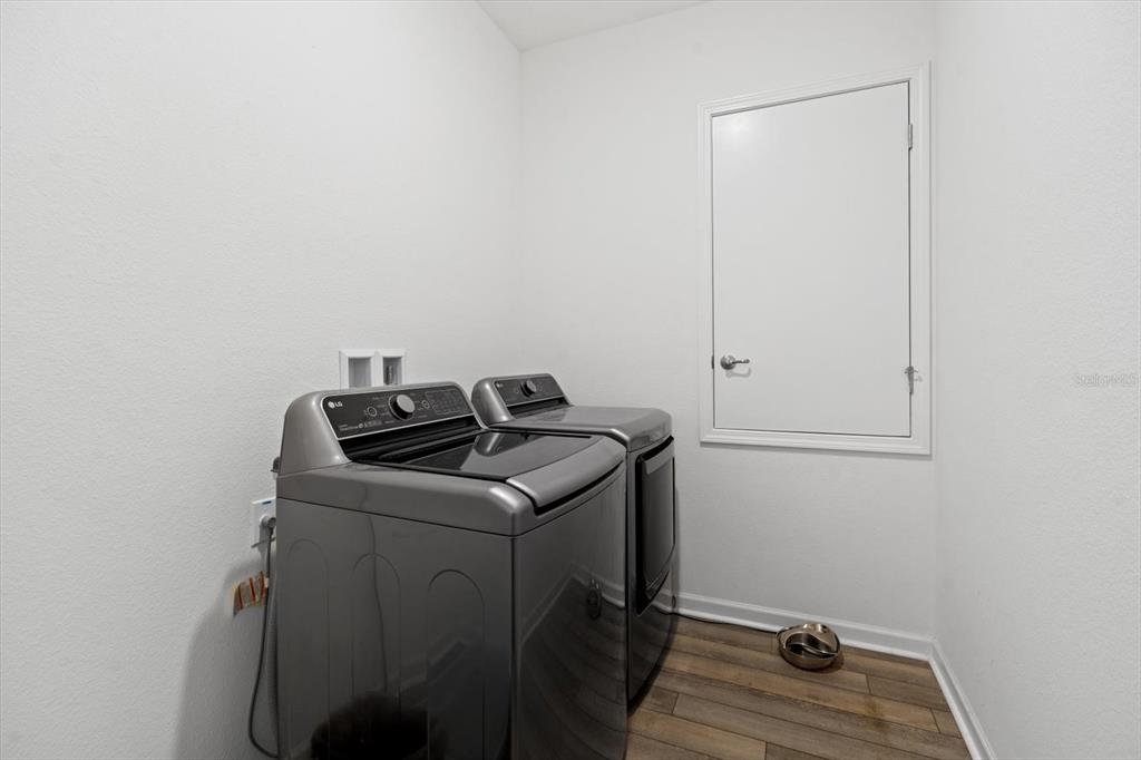 33 Ridge Road Palm Coast, FL 32137 - Photo 16 of 31 a utility room with dryer and washer