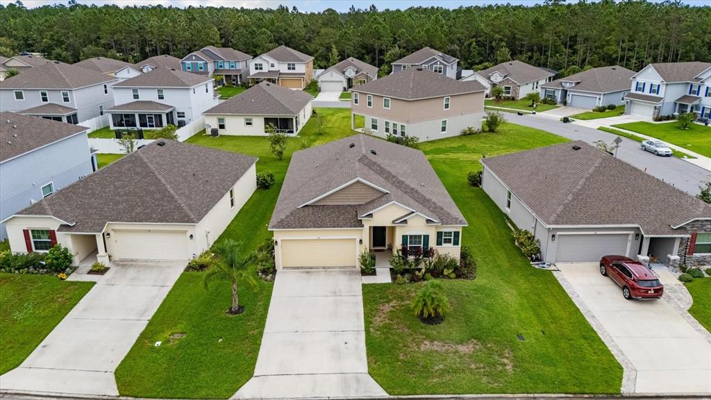 33 Ridge Road Palm Coast, FL 32137 - Photo 29 of 31 a aerial view of a house with a yard