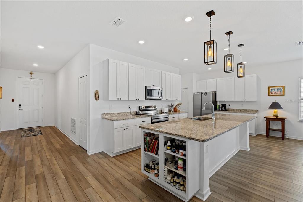33 Ridge Road Palm Coast, FL 32137 - Photo 8 of 31 a kitchen with a sink appliances and cabinets