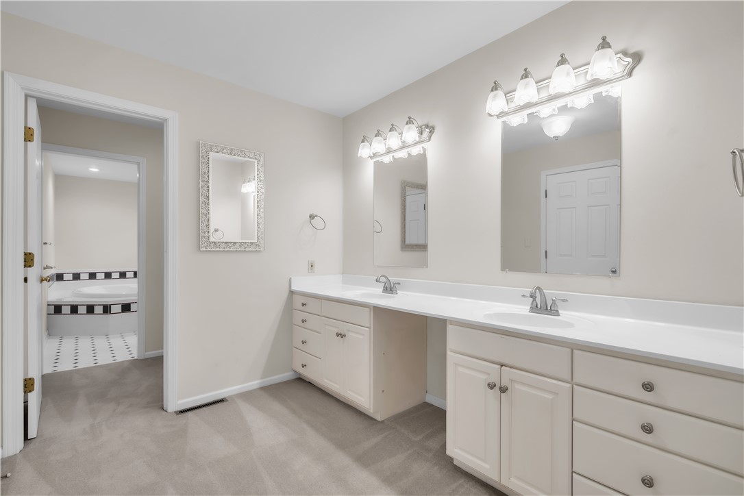 149 Inlet Pointe Drive Anderson, SC 29625 - Photo 16 of 43 Twin vanities and abundant counter space enhance this well-appointed primary bathroom.