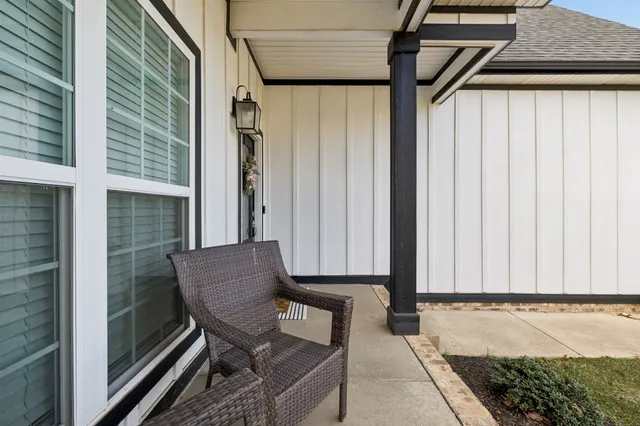 a view of a chair and table in the balcony