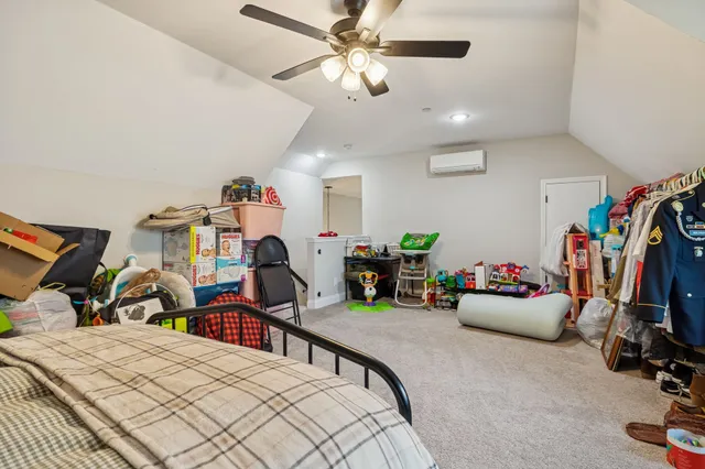 a bedroom with furniture and a bed