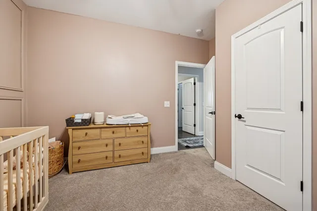 a bathroom with a sink a toilet and shower curtain
