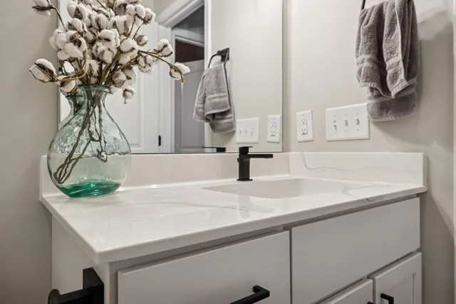 a room with a bed and a chandelier