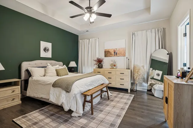 a spacious bedroom with a bed and a walk in closet