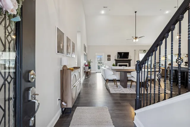 a view of living room with furniture and a flat screen tv