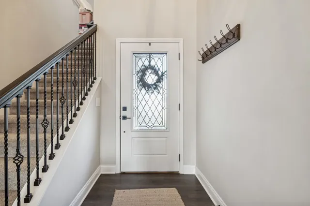 a view of entryway with wooden floor