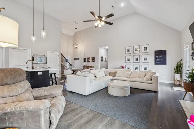 a living room with furniture white walls and white walls