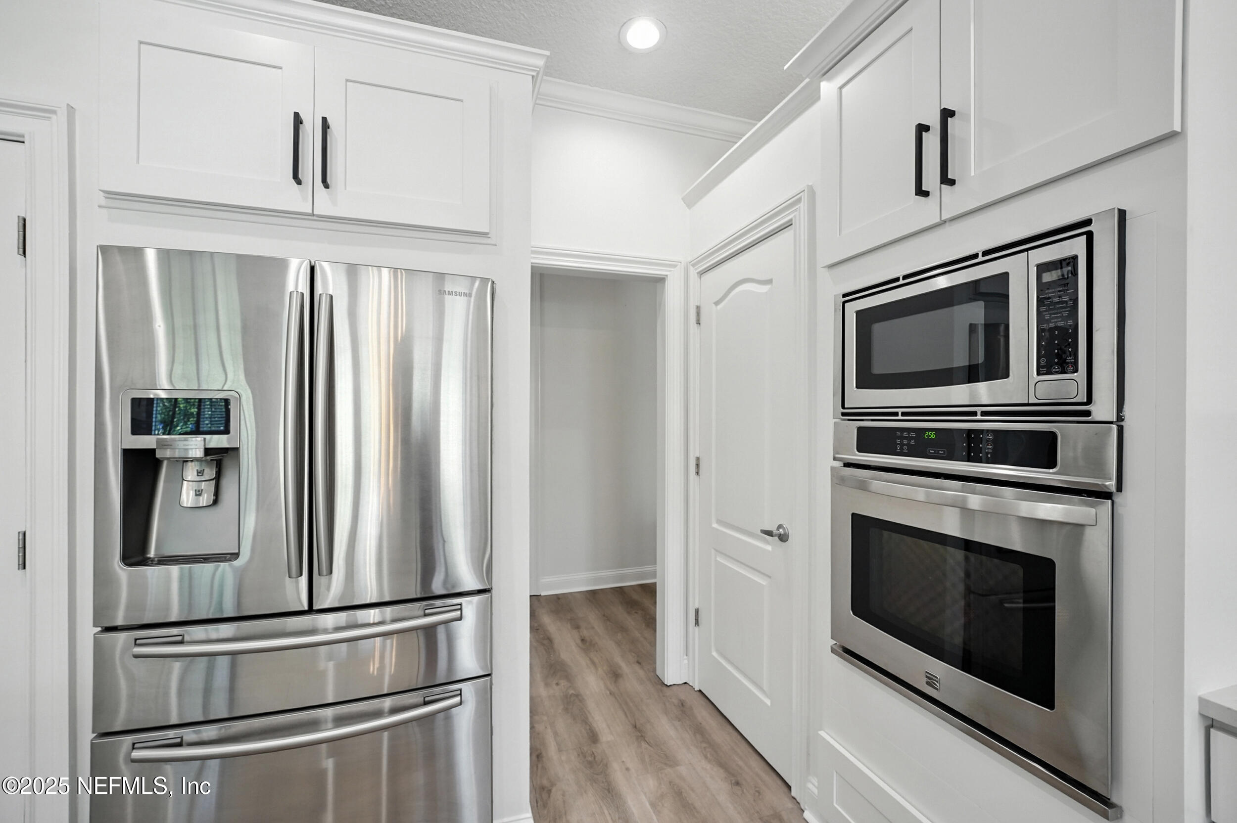 3743 Cricket Cove Road East Jacksonville, FL 32224 - Photo 11 of 55 a kitchen with stainless steel appliances a stove microwave and refrigerator