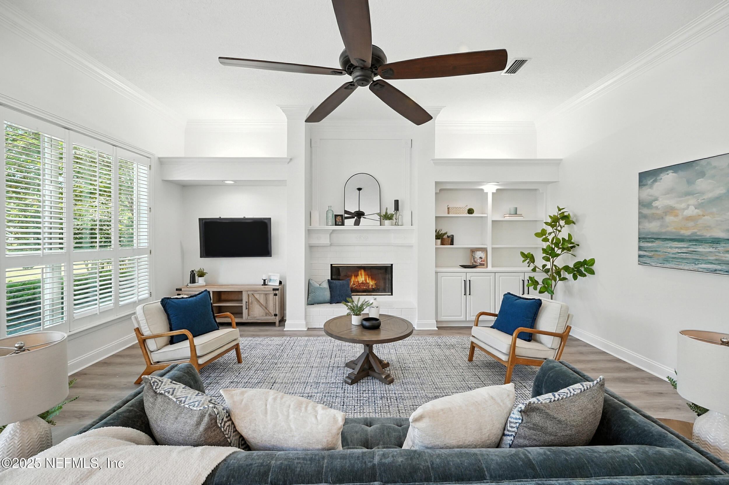 3743 Cricket Cove Road East Jacksonville, FL 32224 - Photo 16 of 55 a living room with fireplace furniture and a flat screen tv