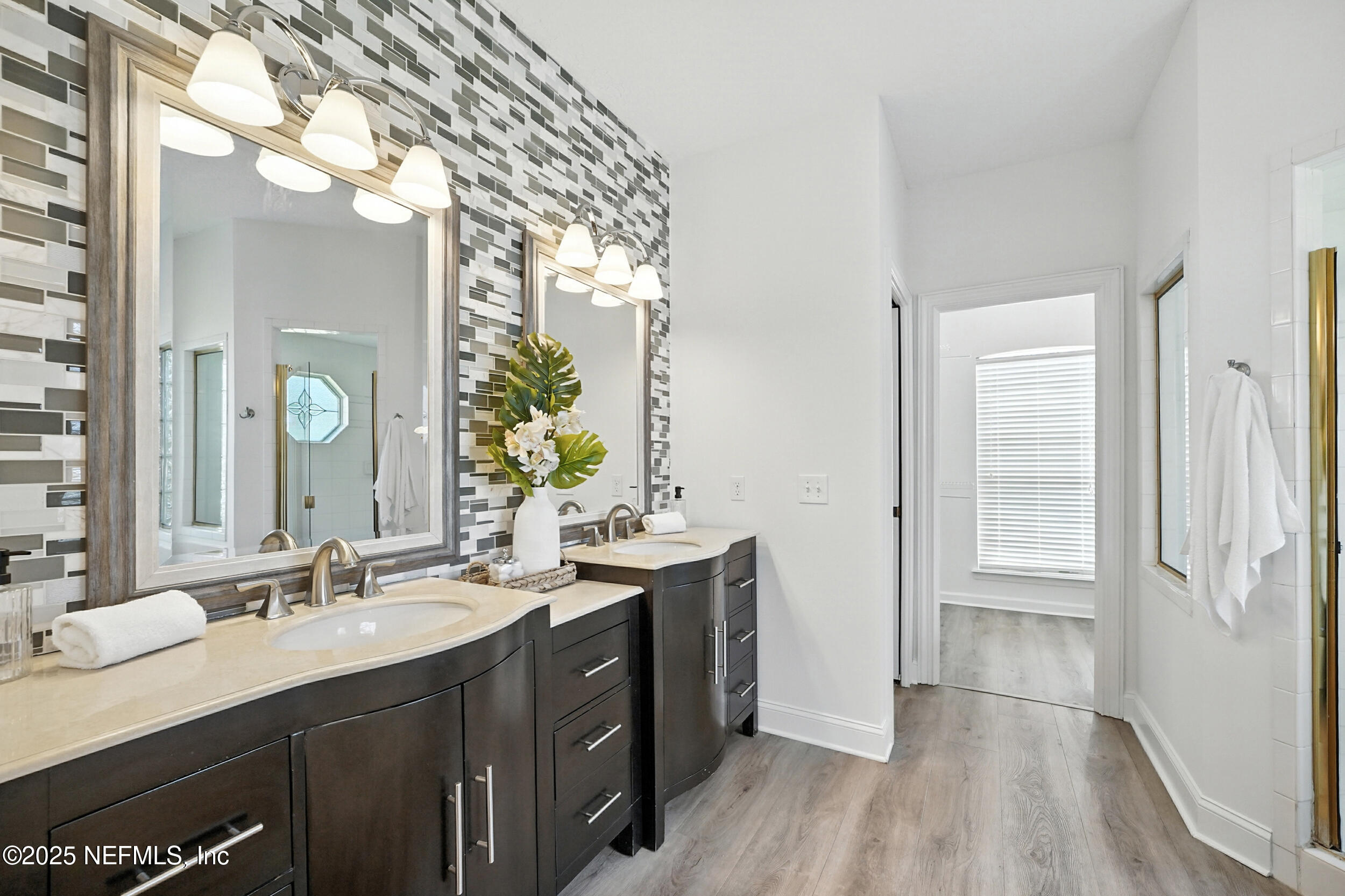 3743 Cricket Cove Road East Jacksonville, FL 32224 - Photo 22 of 55 a bathroom with a double vanity sink and mirror