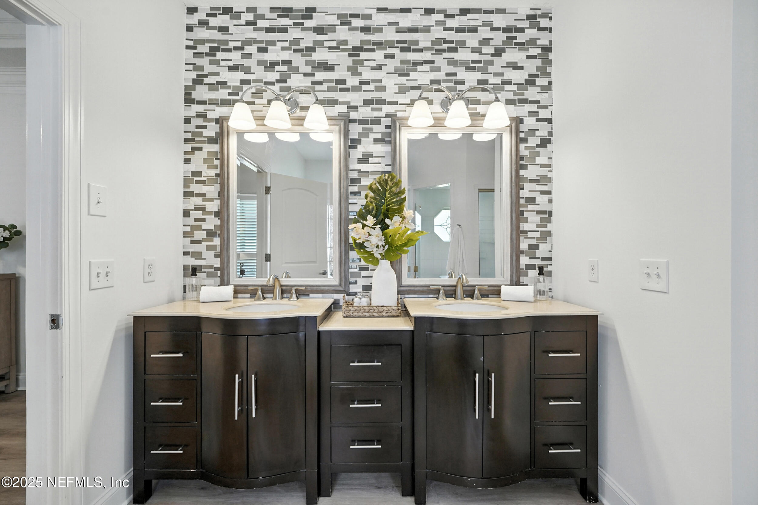 3743 Cricket Cove Road East Jacksonville, FL 32224 - Photo 23 of 55 a bathroom with a granite countertop sink a large mirror and a