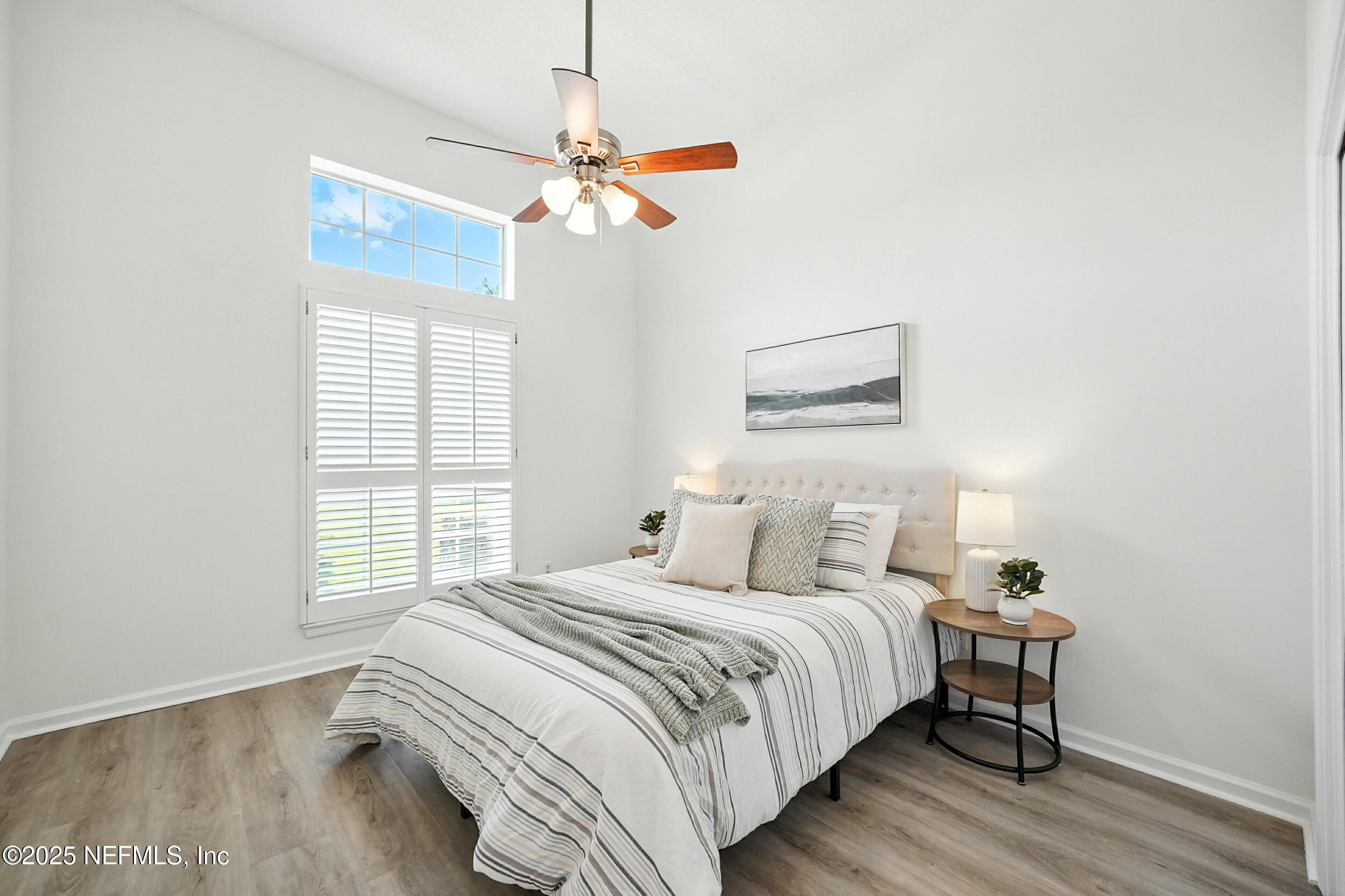 3743 Cricket Cove Road East Jacksonville, FL 32224 - Photo 27 of 55 a bedroom with a bed and a chandelier