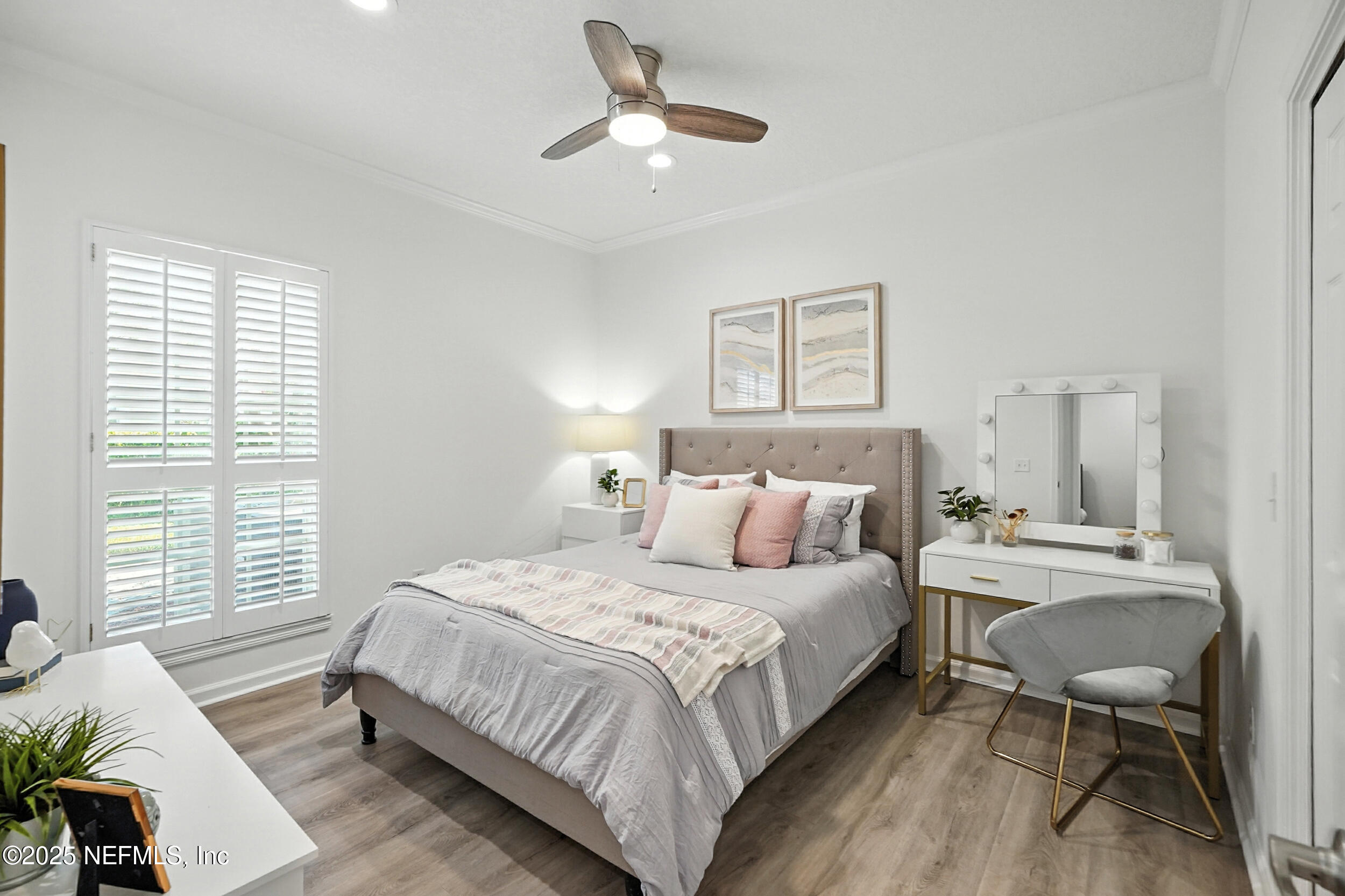 3743 Cricket Cove Road East Jacksonville, FL 32224 - Photo 28 of 55 a bedroom with a bed and a chandelier