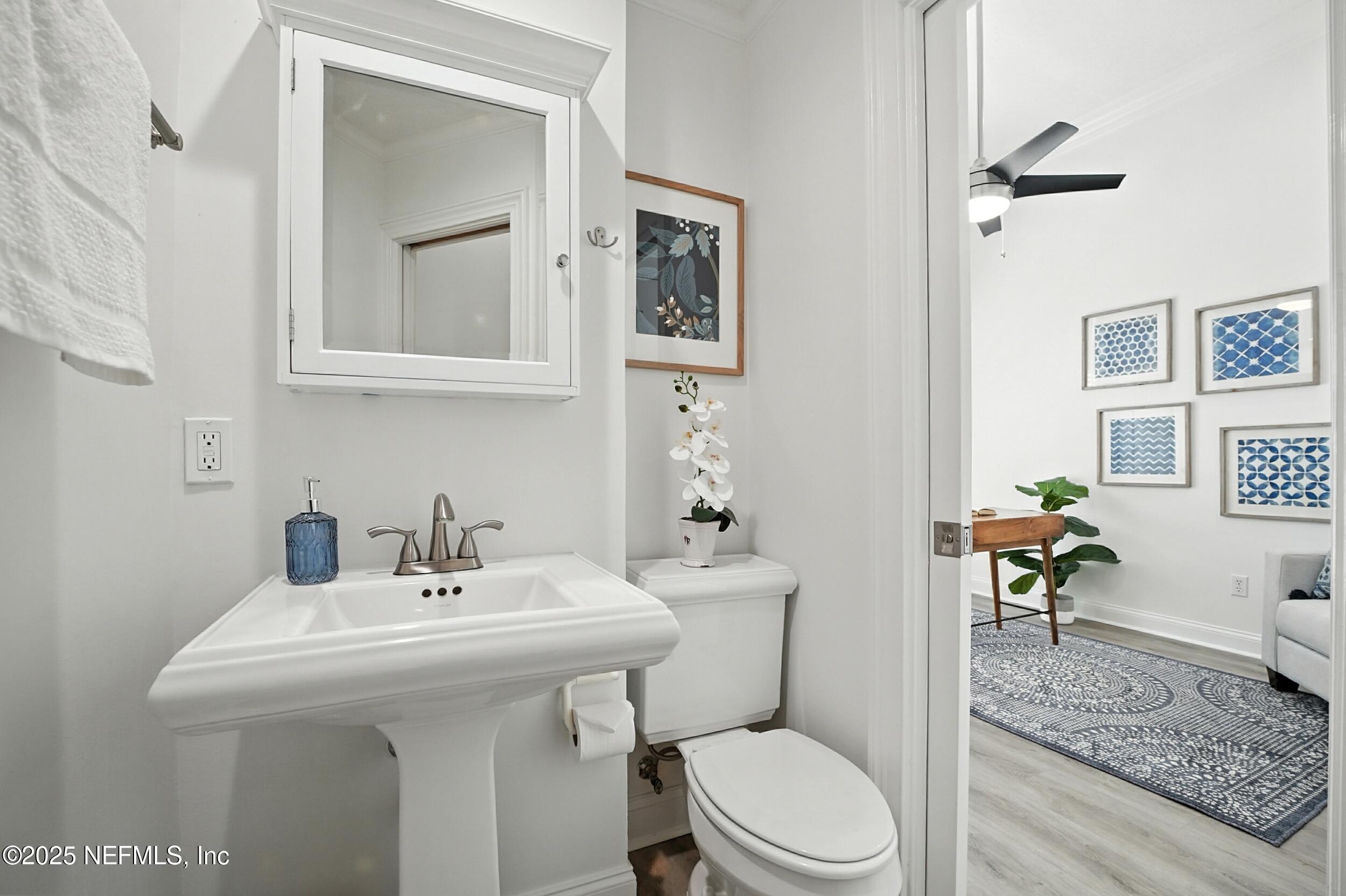 3743 Cricket Cove Road East Jacksonville, FL 32224 - Photo 33 of 55 a bathroom with a sink a toilet and mirror