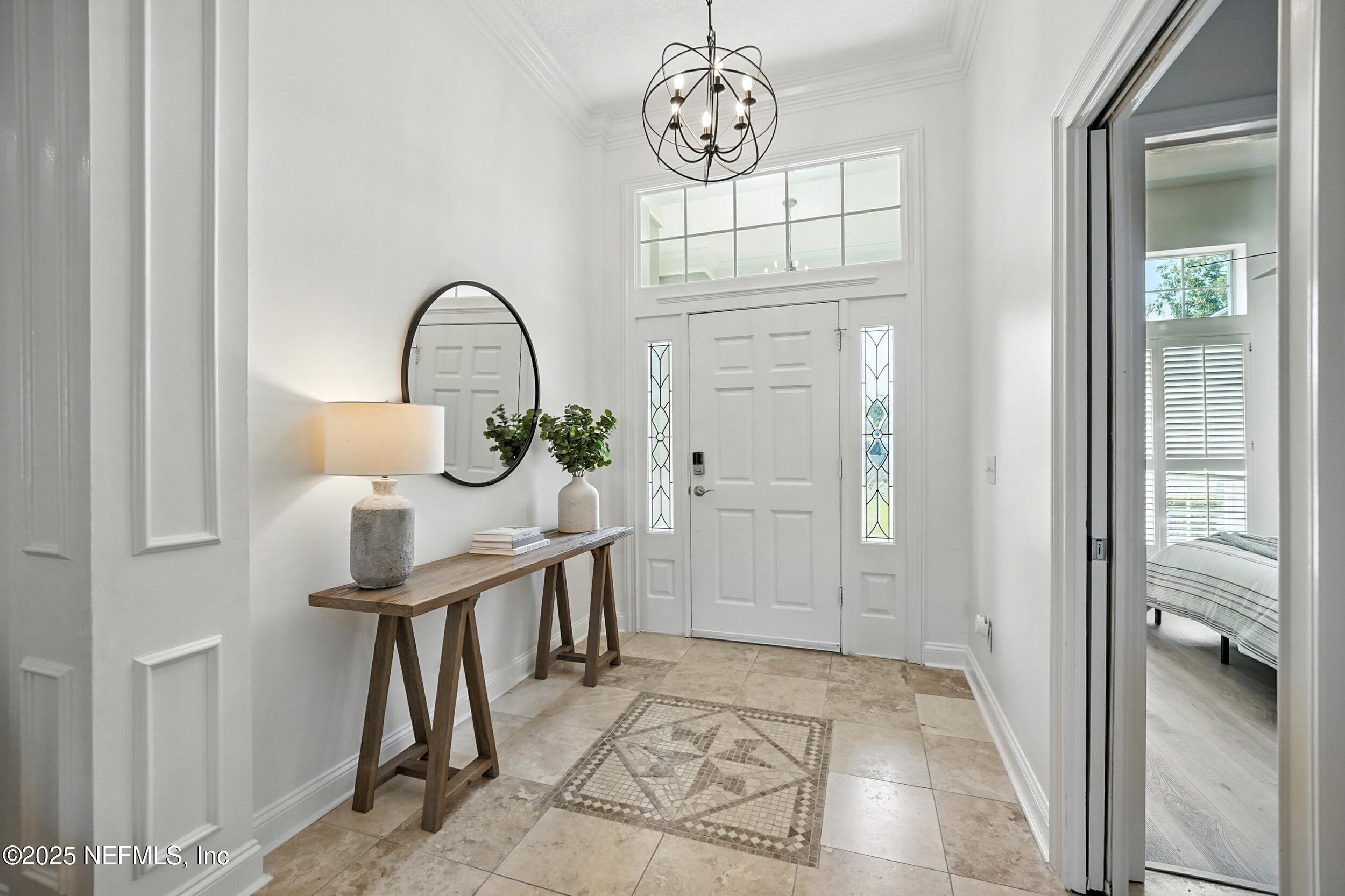 3743 Cricket Cove Road East Jacksonville, FL 32224 - Photo 4 of 55 a view of entryway with a chandelier fan and wooden floor