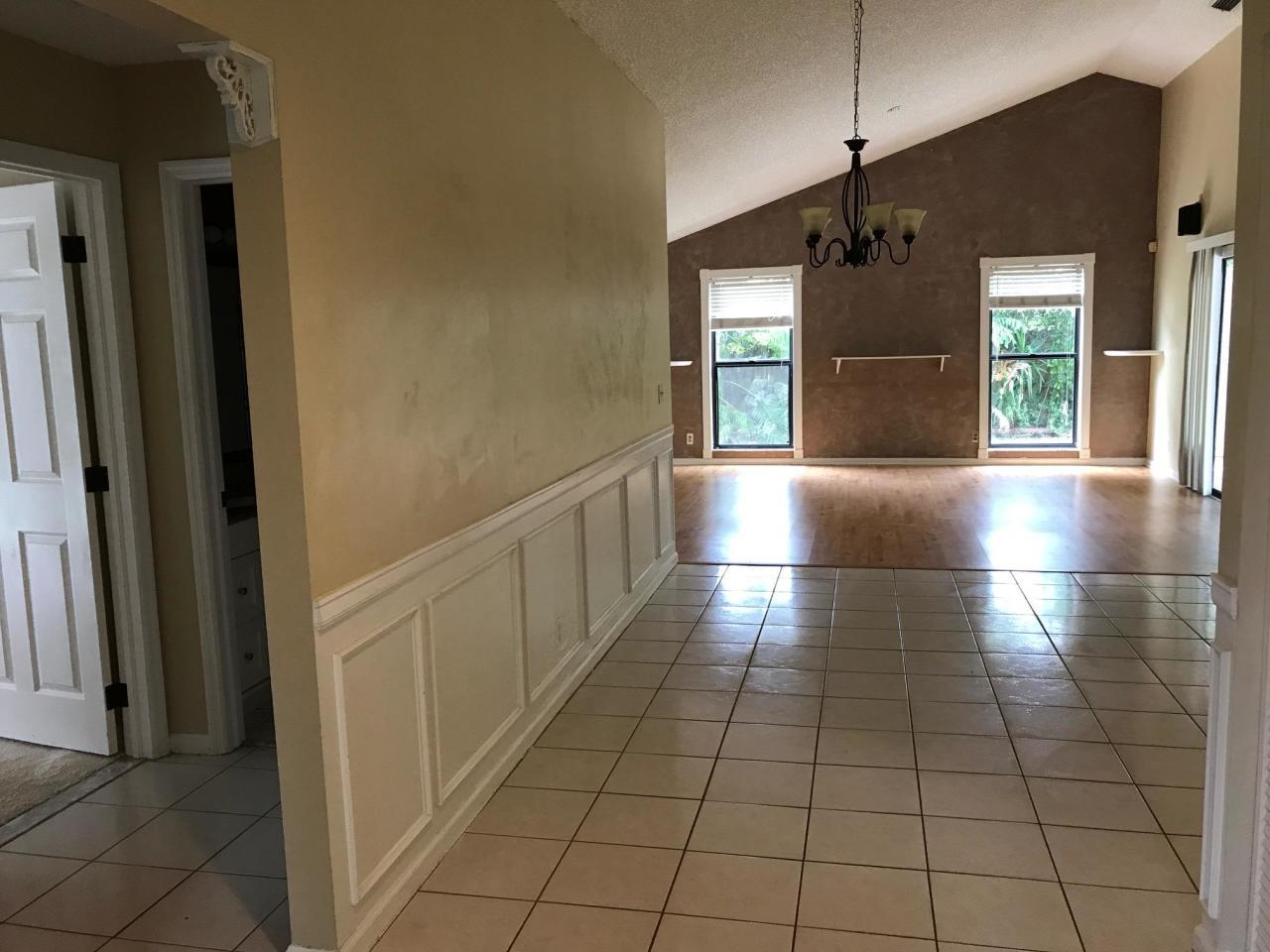 6159 Adams Street Jupiter, FL 33458 - Photo 6 of 13 Foyer to Dining
