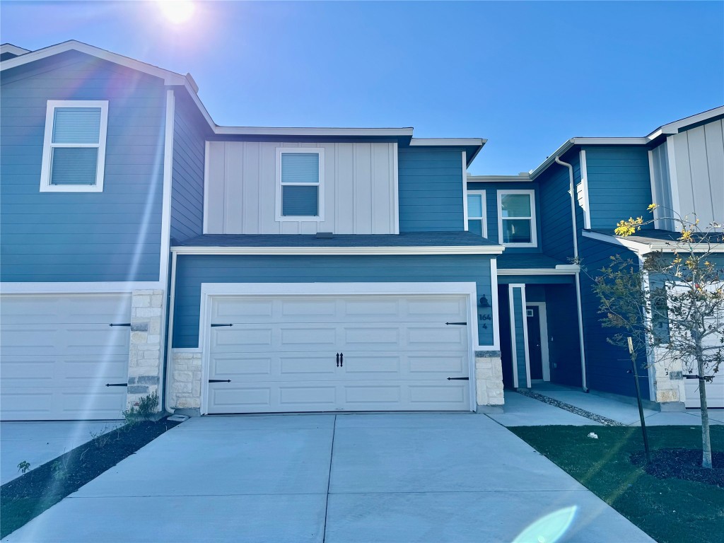 a view of a house with a garage
