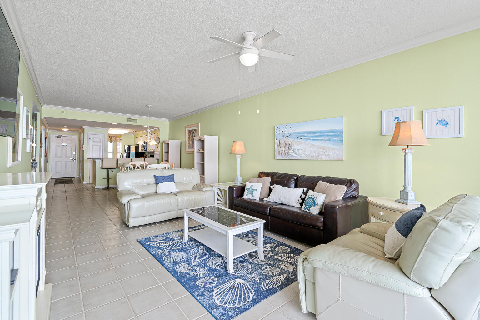 8499 Gulf Boulevard, Unit 303 Navarre, FL 32566 - Photo 13 of 52 a living room with furniture and a large window
