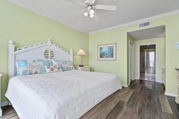 a spacious bathroom with a granite countertop sink a mirror and a bathtub