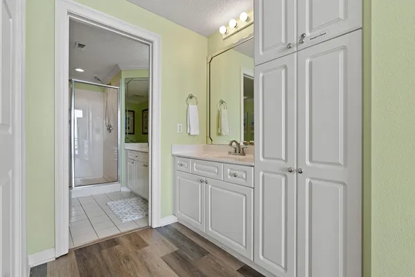 a view of a bathroom from a corridor