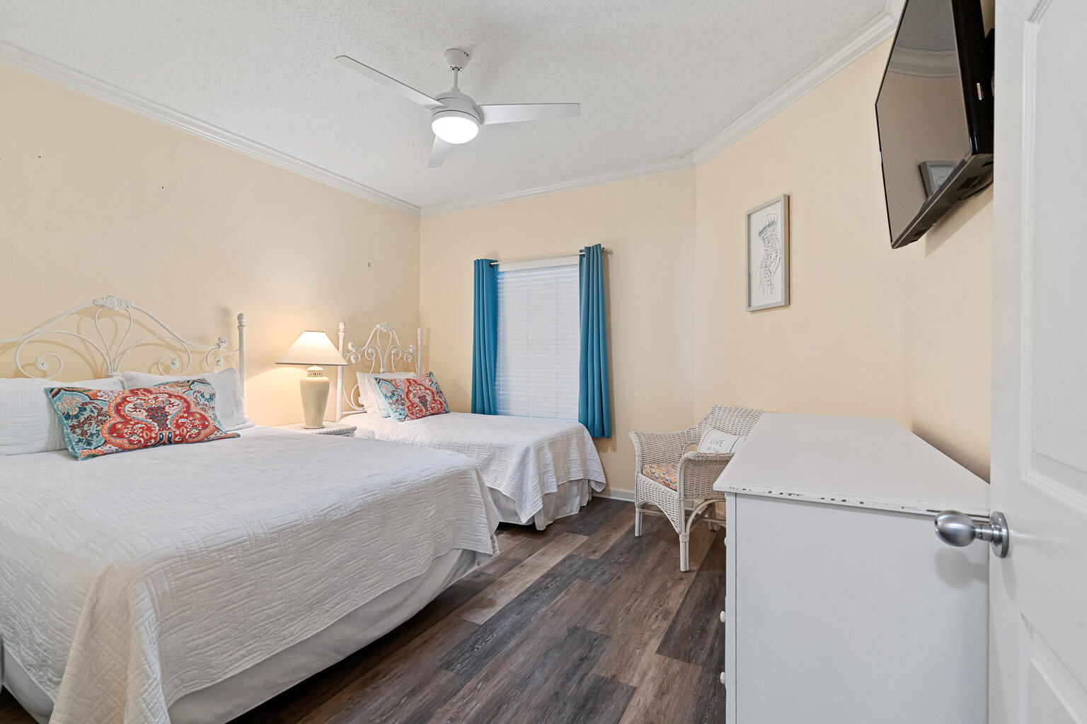 8499 Gulf Boulevard, Unit 303 Navarre, FL 32566 - Photo 22 of 52 a bedroom with a bed and a chandelier