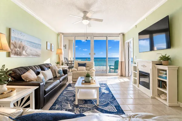 a living room with furniture and a large window
