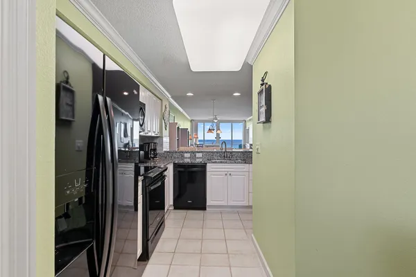 a view of a balcony with wooden floor and fence