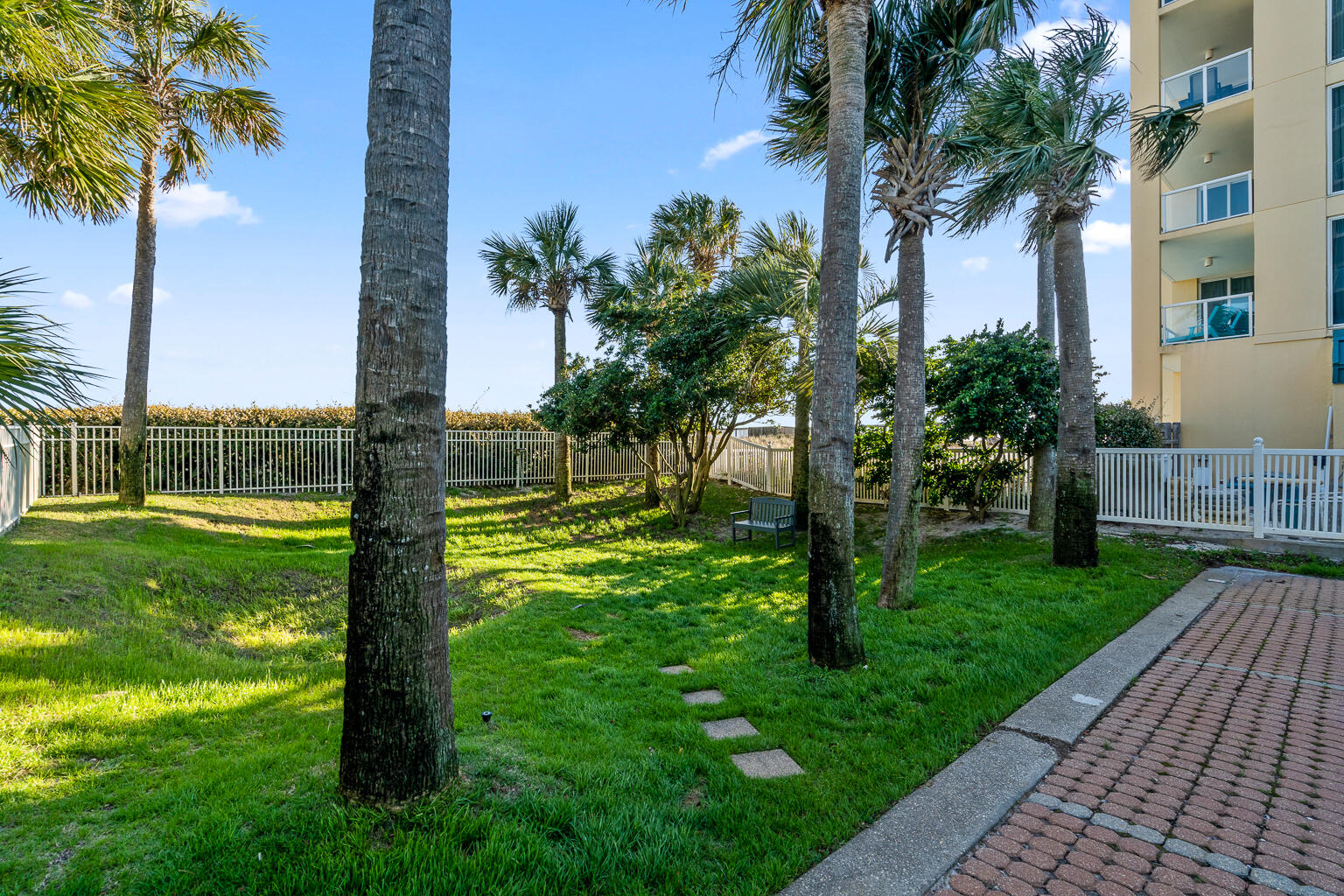 8499 Gulf Boulevard, Unit 303 Navarre, FL 32566 - Photo 46 of 52 a view of a garden with a tree