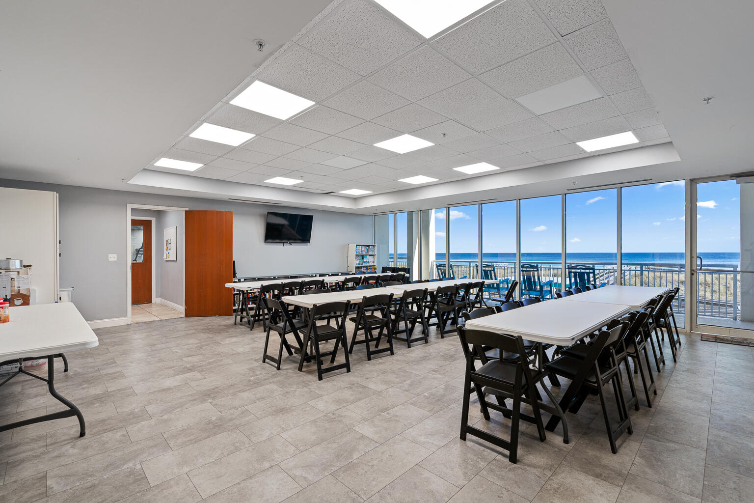 8499 Gulf Boulevard, Unit 303 Navarre, FL 32566 - Photo 52 of 52 a view of a a dining room with furniture window and wooden floor