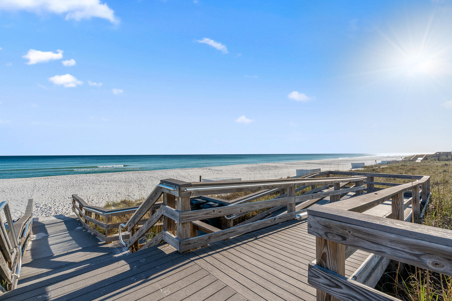 8499 Gulf Boulevard, Unit 303 Navarre, FL 32566 - Photo 6 of 52 a view of a roof deck with wooden floor and ocean view