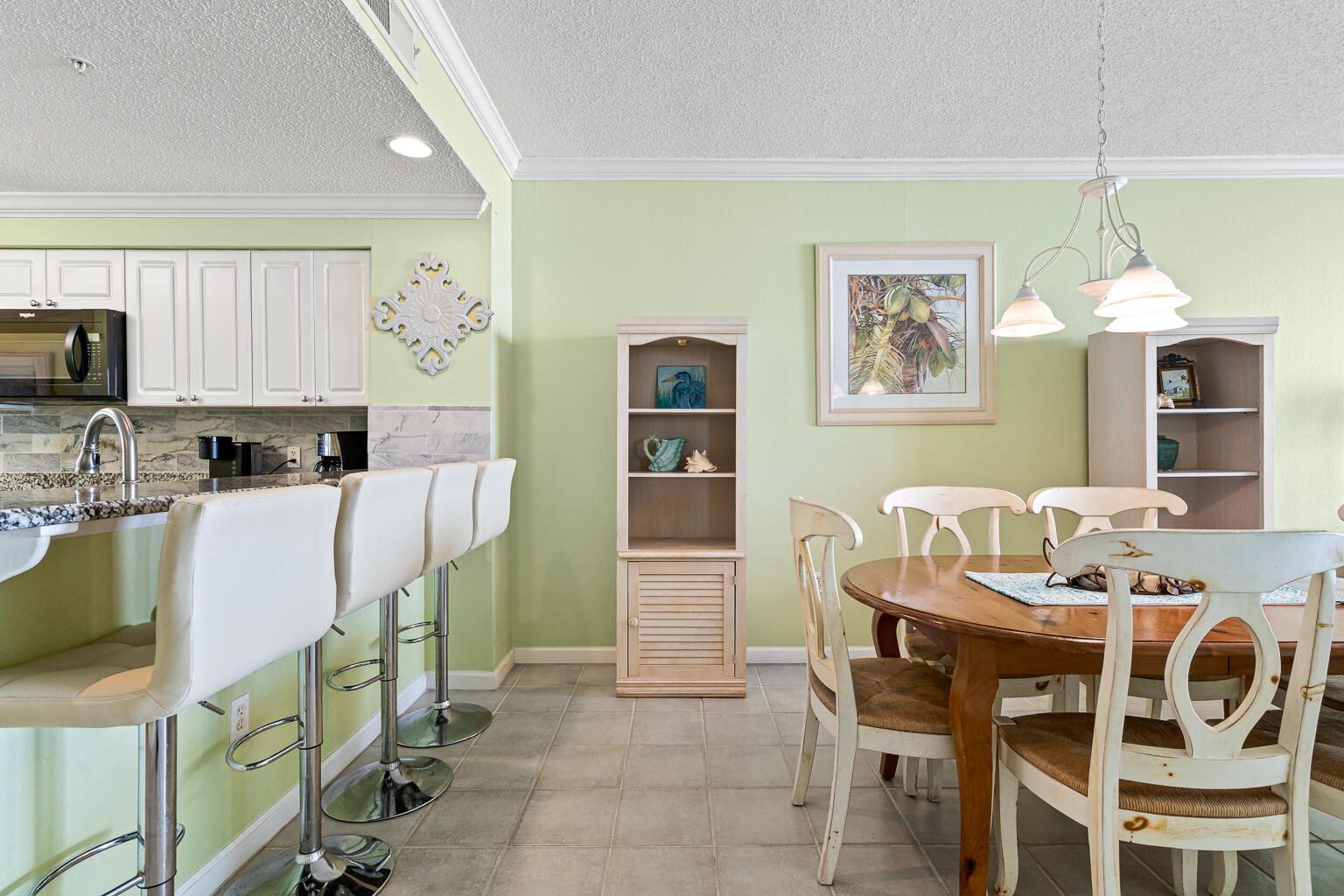 8499 Gulf Boulevard, Unit 303 Navarre, FL 32566 - Photo 9 of 52 a dining room with furniture and window