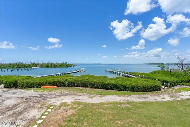 a view of a lake and green space