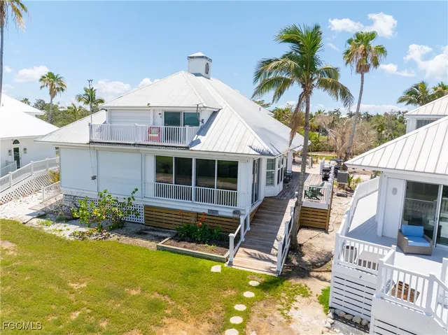 a front view of house with an ocean view