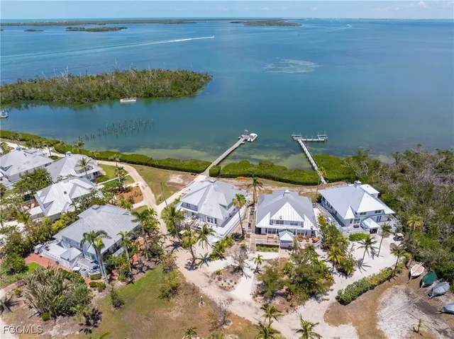 an aerial view of a house with a lake view